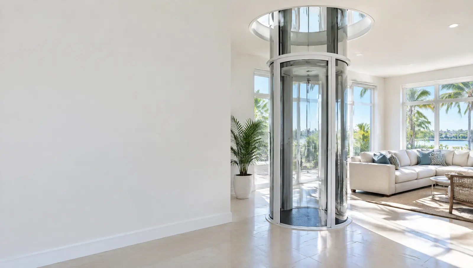 Round transparent pneumatic vacuum elevator rising through the ceiling of a bright living room